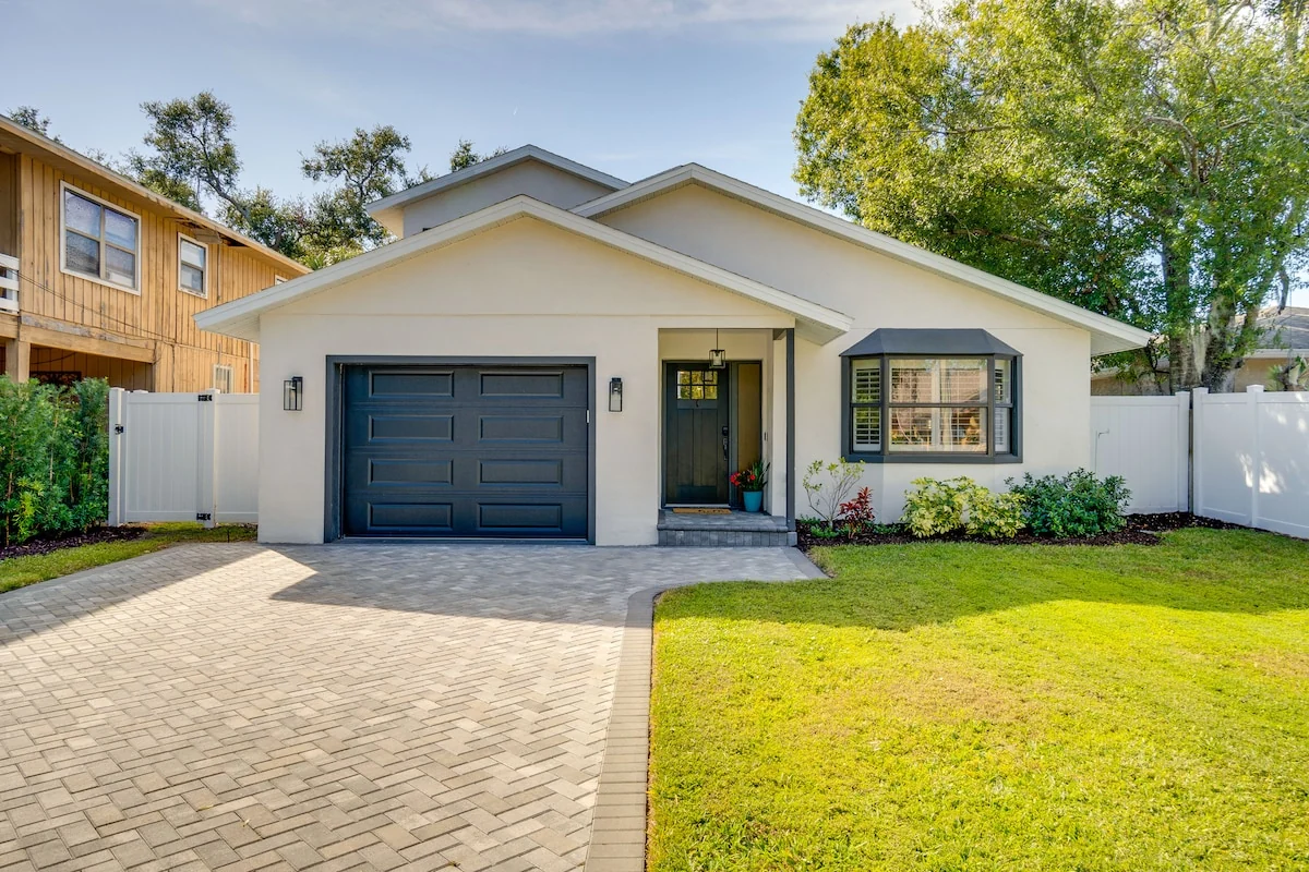 Front exterior of Mova Manor, a spacious white Sarasota residence